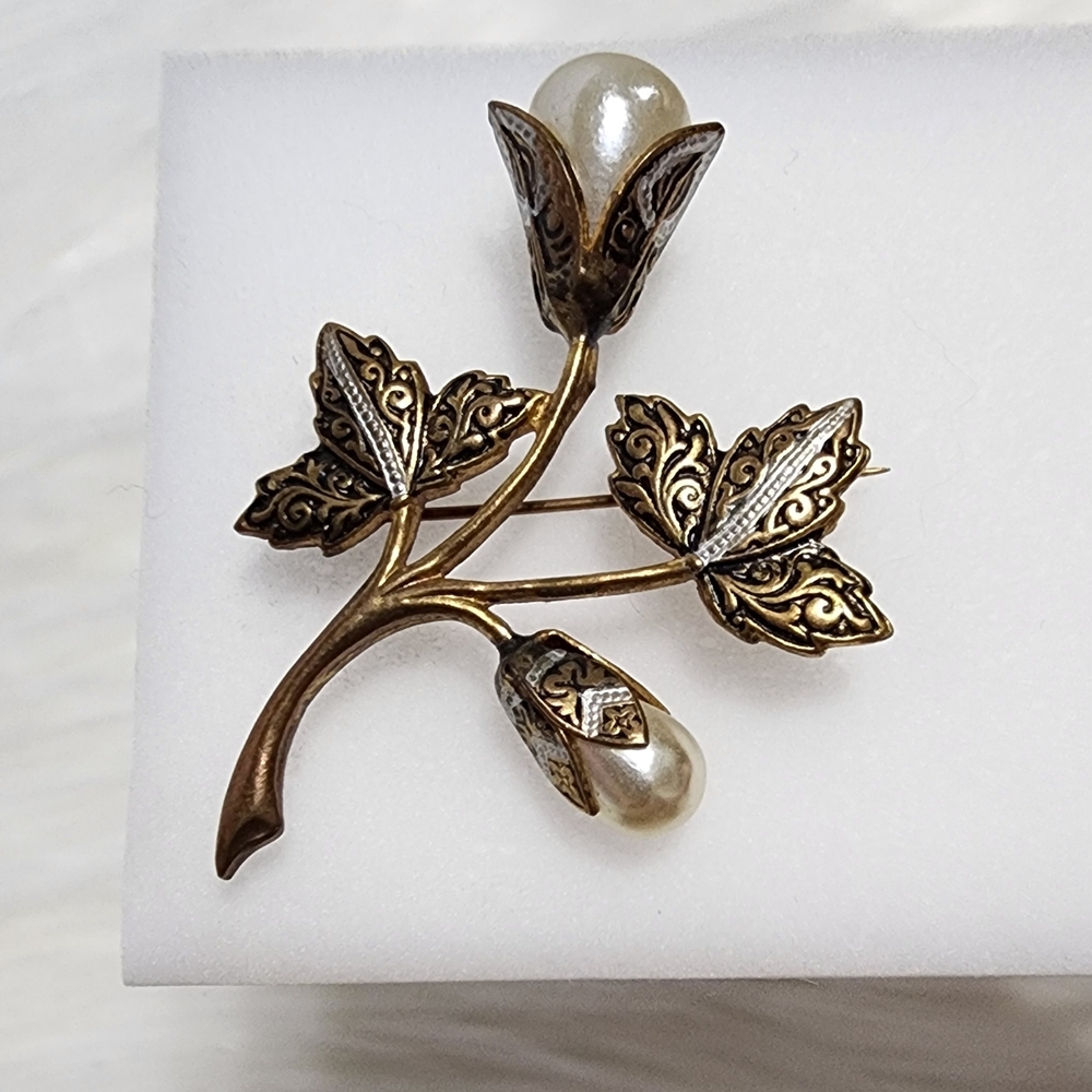 Elegant Gold and Silver Floral Brooch